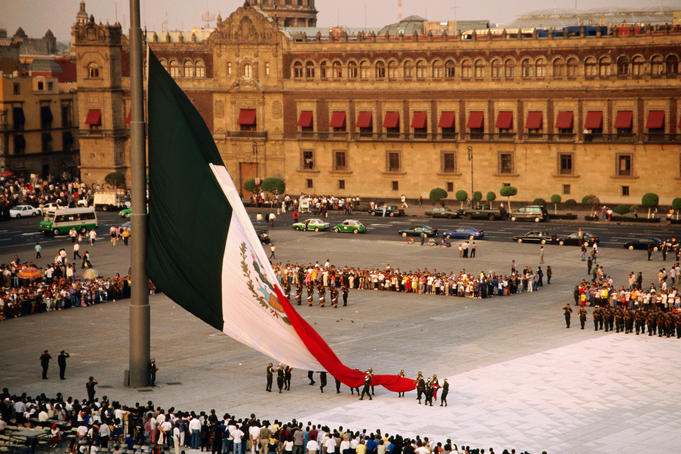 Overhead of ceremonial lowering of Mexican flag in the Zócalo (main city square), Mexico City
