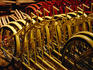 Becak rear wheel assemblies in factory.