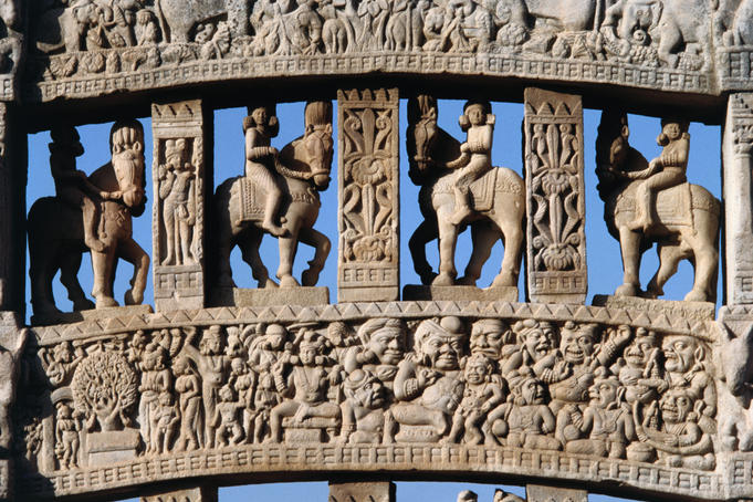 Detail of temple carving, in front of Great Stupa.