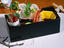 Bento box of sushi (fresh slices of raw fish of tuna, prawn and flounder with herbs) accompanied with soy sauce and wasabi, at Hanasanshou, Japanese-style restaurant, Shiba Park Hotel, Tokyo