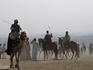 Camel drivers on a windy day at the Pyramids.