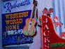 Club signs on Broadway.