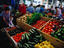 Shopping at Farmer's Market. Barrels of squash.