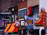 Signs above businesses on Broadway.