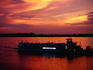 Riverboat on Mississippi River at sunset.