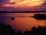 Boat on Mississippi River at sunset.