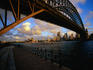 Opera House and harbour underneath bridge.