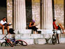 People relaxing on the steps of the Temple Theseus.