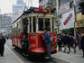 View along Taksim Square with a tram in the foreground, Istanbul. Except for the tram this is a pedestrian only street.