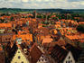 View over the high pitched, terracotta tiled roofs of the Medieval city of Rothenburg ob der Tauber.