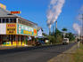 Castor Hotel , cane cutters watering hole, with sugar mill in background, Mourilyan.