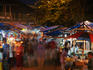 Crowd shopping at night market.