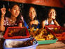 Young women at food stall (warung kopi).