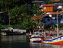 Colourful fishing boats docked in harbour.