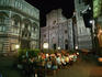 People dining outdoors outside the Duomo.