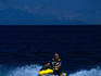 A man riding a jet-ski in the waters off Brac Island.