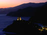 Genoese tower illuminated at night.