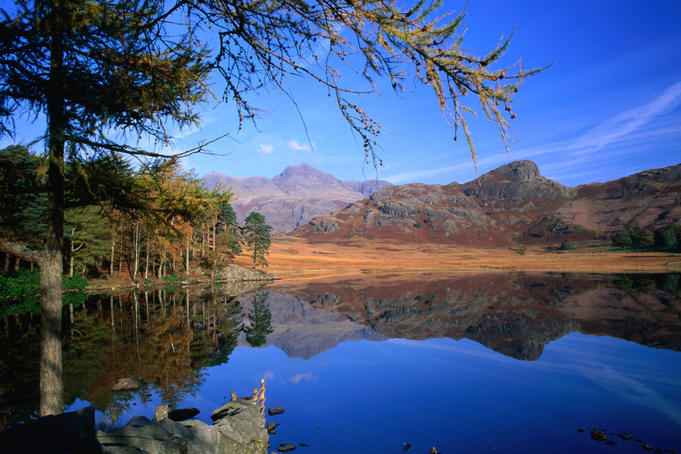 The view across Blea Tarn to the Langdale Pikes.