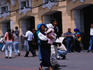 Indian family on Plaza de la Independencia. The mother is wearing traditional dress- Quito, Ecuador