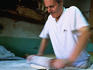 Filo pastry is flattened and rolled into small disks after standing for approximately 15-20 minutes.