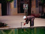 A mullah washes his hands in the courtyard of the Khan Madrassa (Khan School) of Shiraz.
