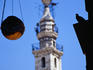 An incense holder and one of the three minarets of the Umayyad Mosque of Damascus.