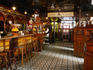 Interior of the Crown Liquor Saloon bar area which features ornate glass, tile and wooden decoration and furnishings, Belfast.