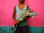 Young boy holding an endangered iguana. His poverty may lead him to sell it as food - Kilometro Treinta.