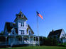 The US flag and houses of New England.