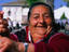 Gypsy woman demonstrating how to play castanets.