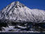 Snow-covered coastal mountain in the Arctic Circle.