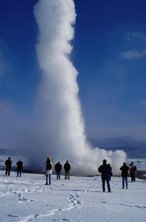 Spectators watching eruption of Stokkur geyser.