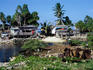 Funafuti Atoll, July 1999. A shortage of land on Funafuti has led to housing being built around and on the rubbish-filled borrow pits, from which coral was excavated to build the airfield.