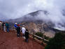 Visitors regard Poas Volcano, a stratovolcano with both an active and a dormant volcano. The crater has been active since 1834.