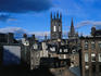 Churches rise above buildings in the city centre. The building with the square tower now houses a pub called Slain's Castle.