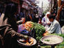 In view of the minaret of the Mosque Al-Hakim are the markets of Sugar street in Islamic Cairo made famous by the writings of Naguib Mahfouz.