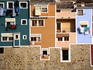 Washing hangging from windows in brightly painted houses in La Vila Joiosa, near Benidorm.