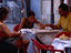Ordering a meal at a restaurant in the Plaza de la Virgen.