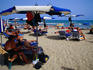 Playa del Postiguet, the city's crowded main beach with its trademark blue and white umbrellas.