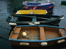 Colourful rowing boats in port.