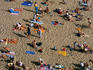 Sunbathers on Plage du Mole (beach).