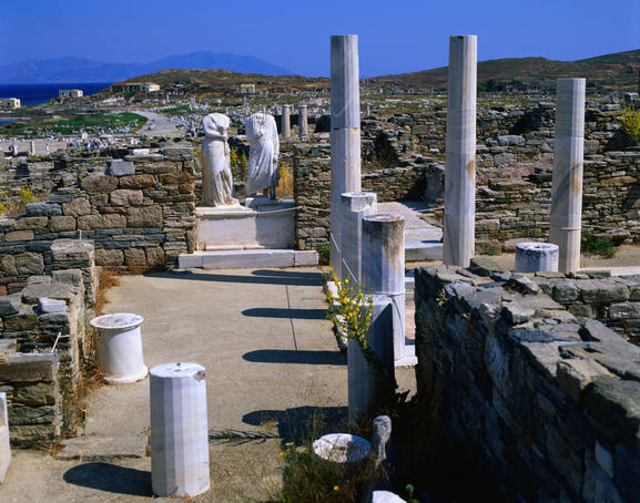Headless statues remain standing in the ruins of the House of Cleopatra.