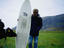 A local sniffs the wax on a visiting surfers board in the coastal village of Unstad in Lofoten.