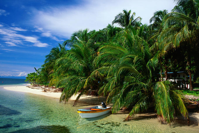 Boat moored on the beach.