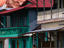 People standing in front of their houses.