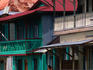 People standing in front of their houses.