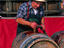A winemaker at work on a barrel of wine in the renowned Beaujolais region.