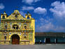 The bizarre, highly decorated bright yellow church of San Andres Xecul in Totonicapan.