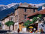 Village buildings beneath Pirin Mountains.