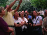 A group of Italian tourists look impressed by Agios Nicholaos Ravagas Church.